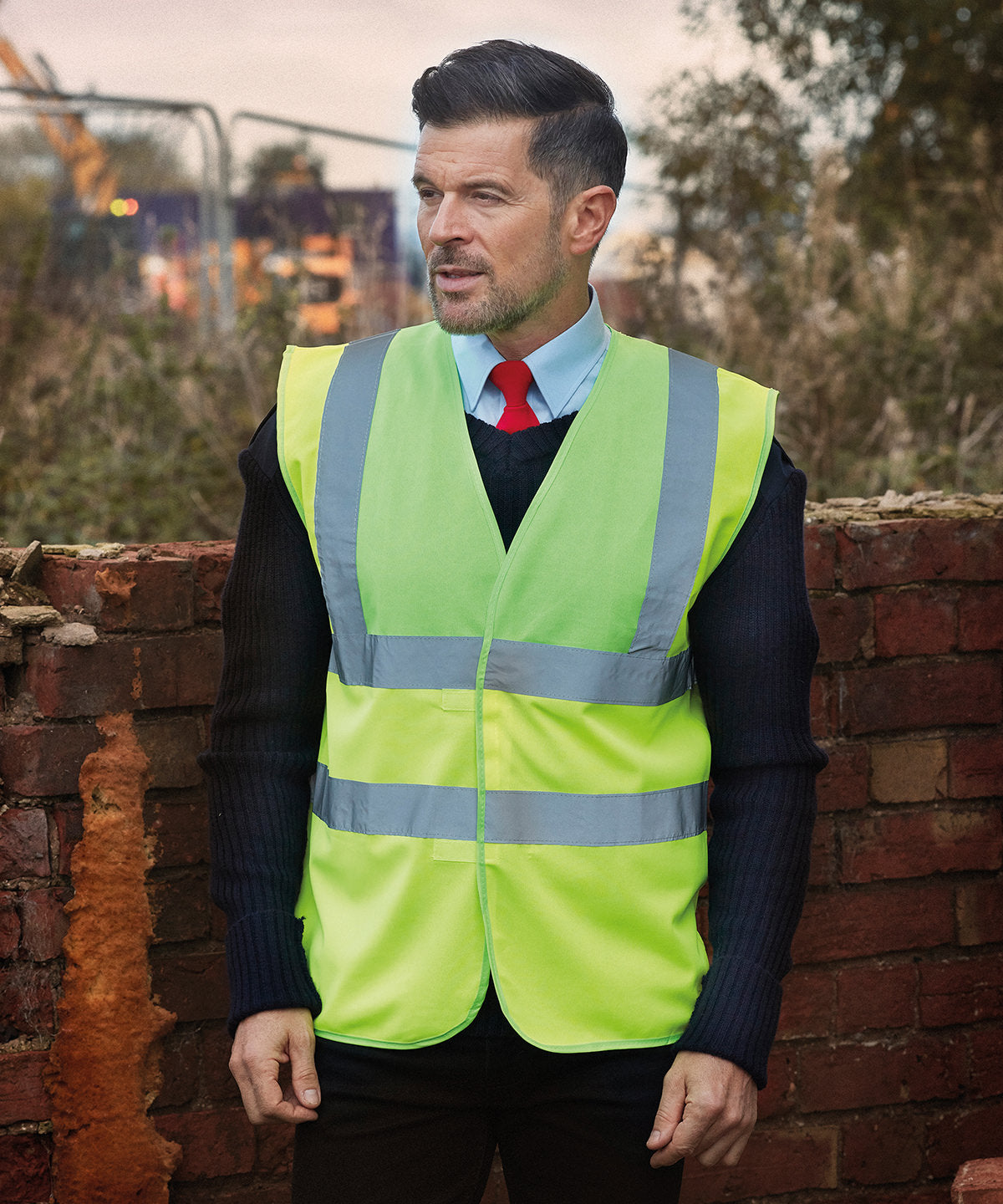 EN ISO 20471 Class 2 hi-vis vest in fluorescent yellow, worn on site