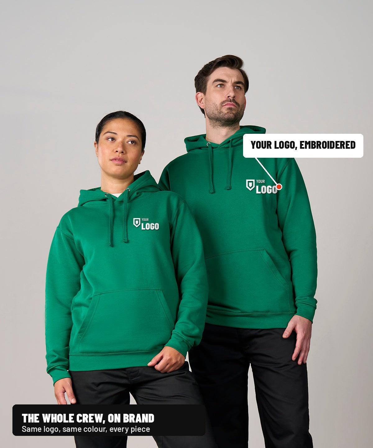 Two people wearing Pro hoodies with a logo embroidered on the left chest