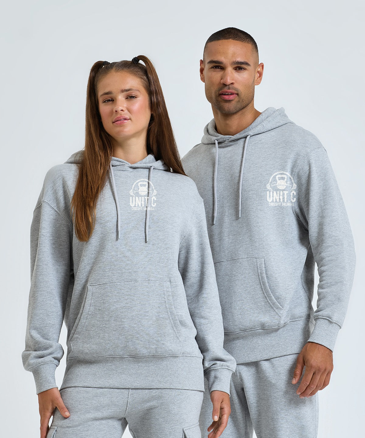 UNIT.C hoodies worn by two members